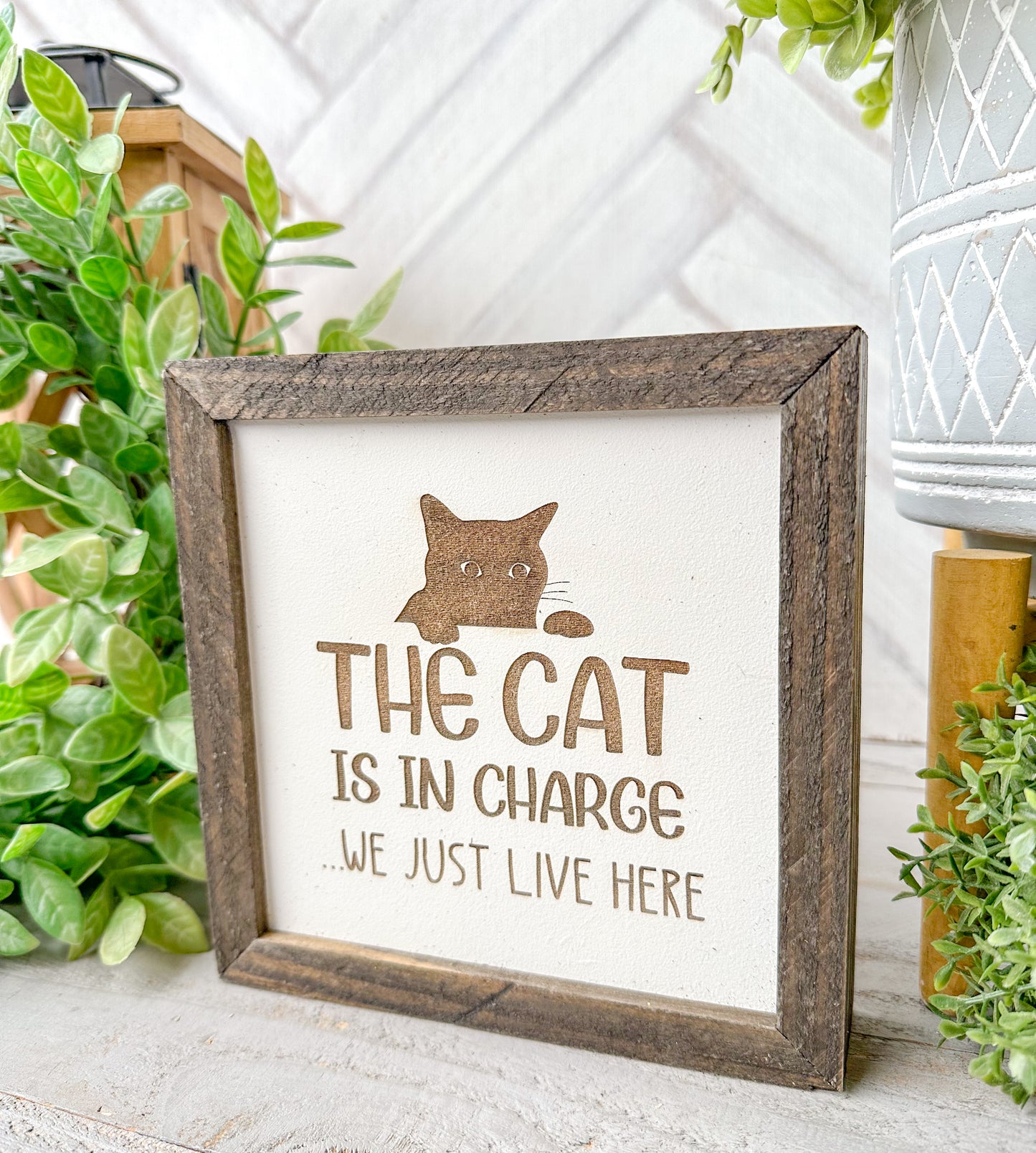 The cat is in charge we just live here. Laser engraved wood sign