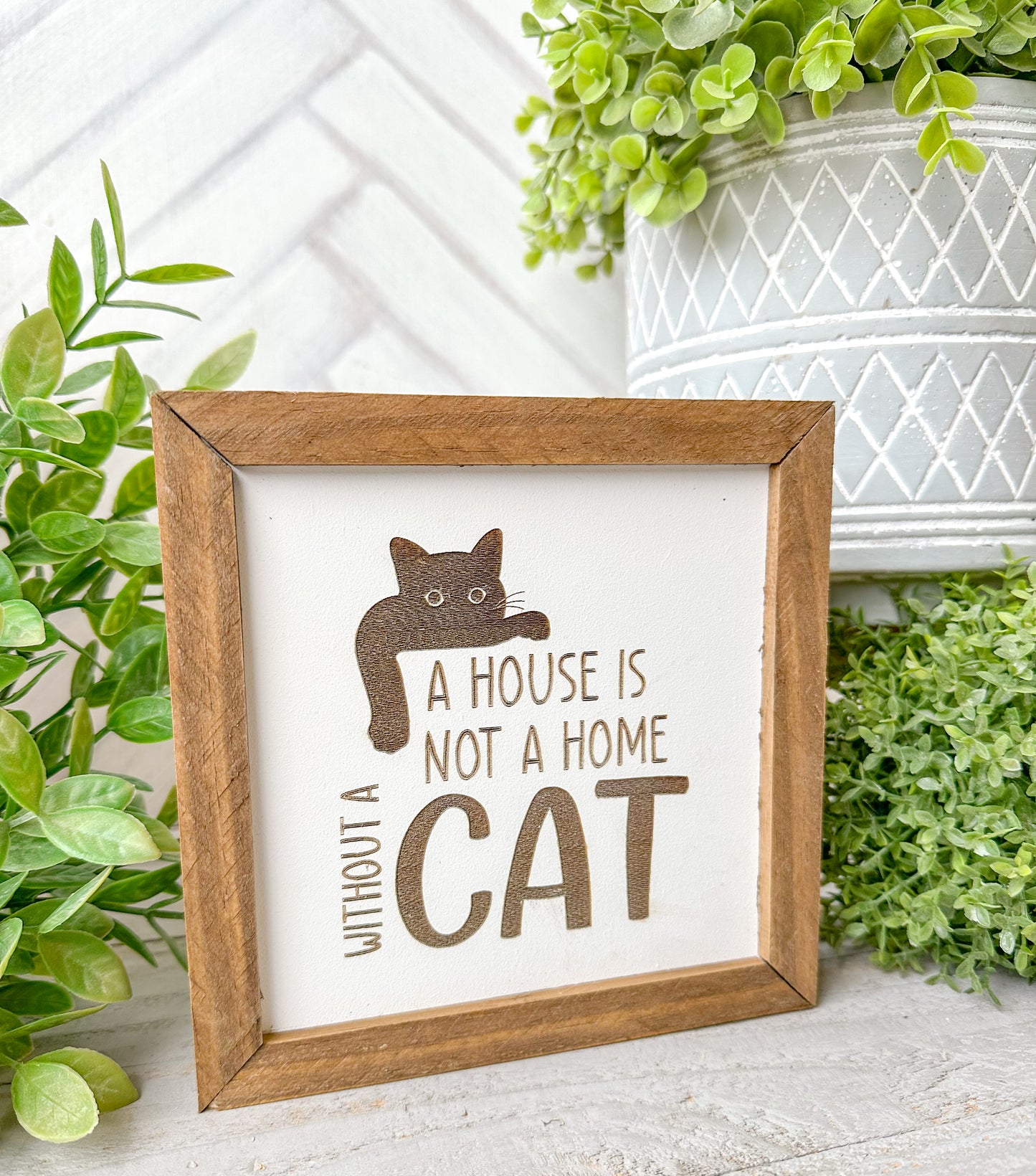 A house is not a home without a cat. Laser engraved wood sign.