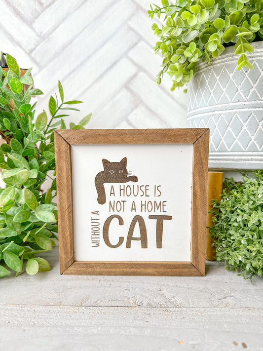 A house is not a home without a cat. Laser engraved wood sign.