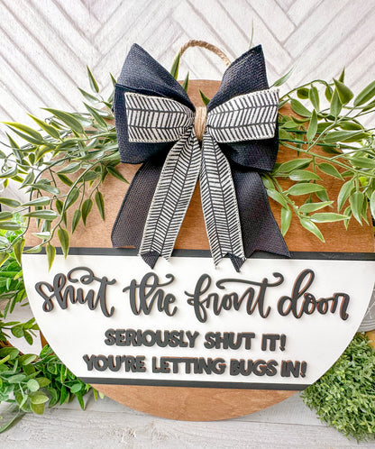 Shut the front door! Seriously shut it! You’re letting the bugs in! Wooden door round.