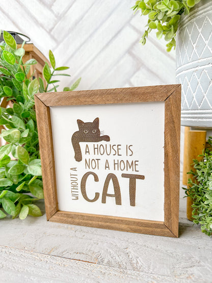 A house is not a home without a cat. Laser engraved wood sign.