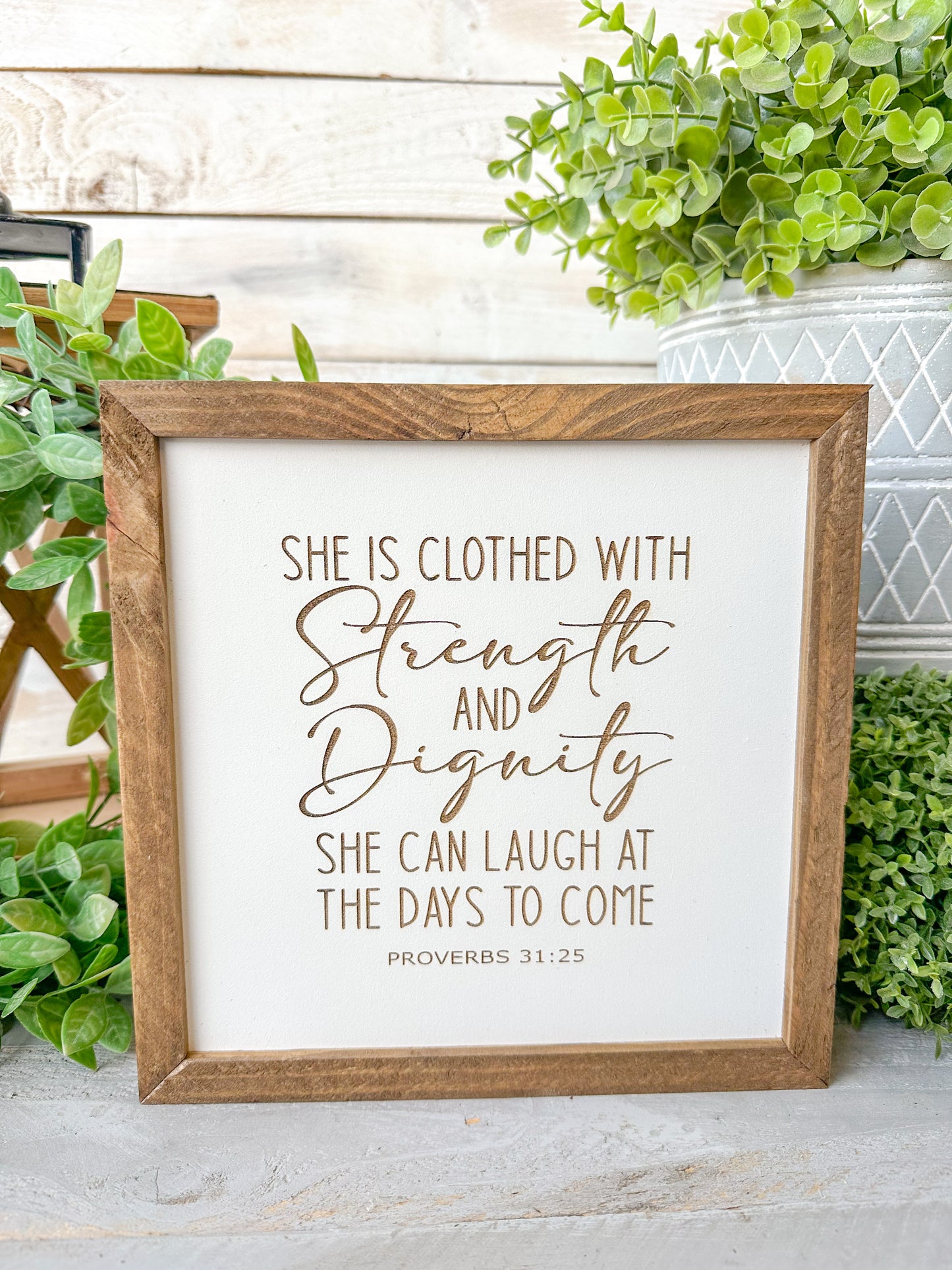She is closed with strength and dignity. She can laugh at the days to come Proverbs 31:25. Laser engraved wood sign.