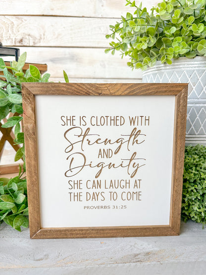 She is closed with strength and dignity. She can laugh at the days to come Proverbs 31:25. Laser engraved wood sign.