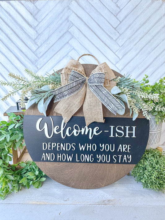 Funny Welcome-ish Sign - 18” Handcrafted Wood Round with Burlap Bow & Greenery
