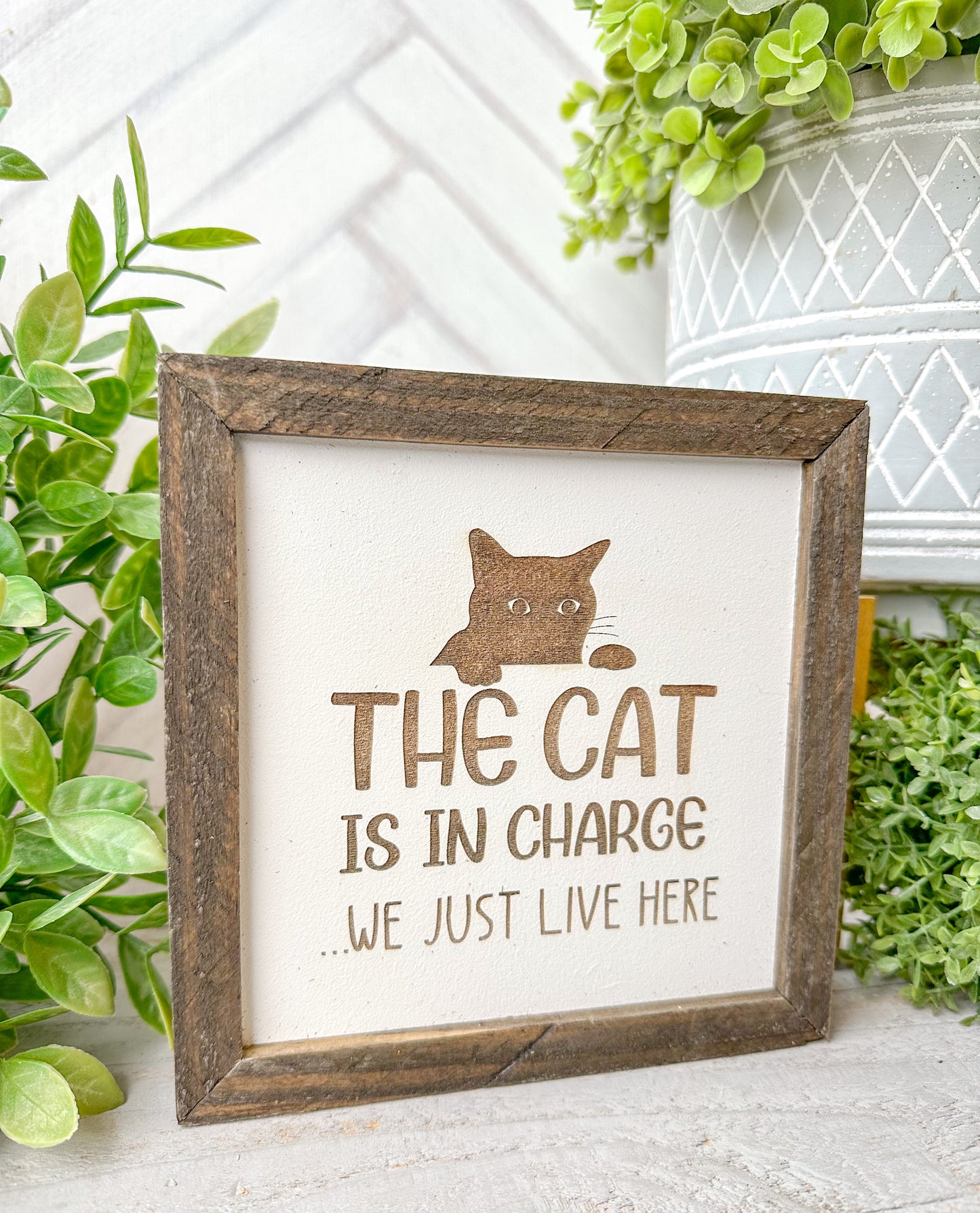 The cat is in charge we just live here. Laser engraved wood sign
