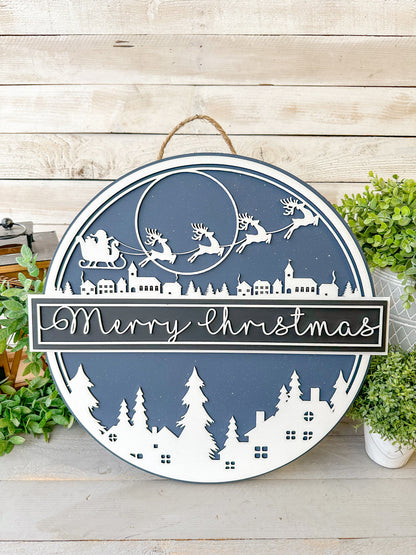Santa’s Sleigh Merry Christmas Village Round Wood Round – 18” Layered Holiday Door Sign