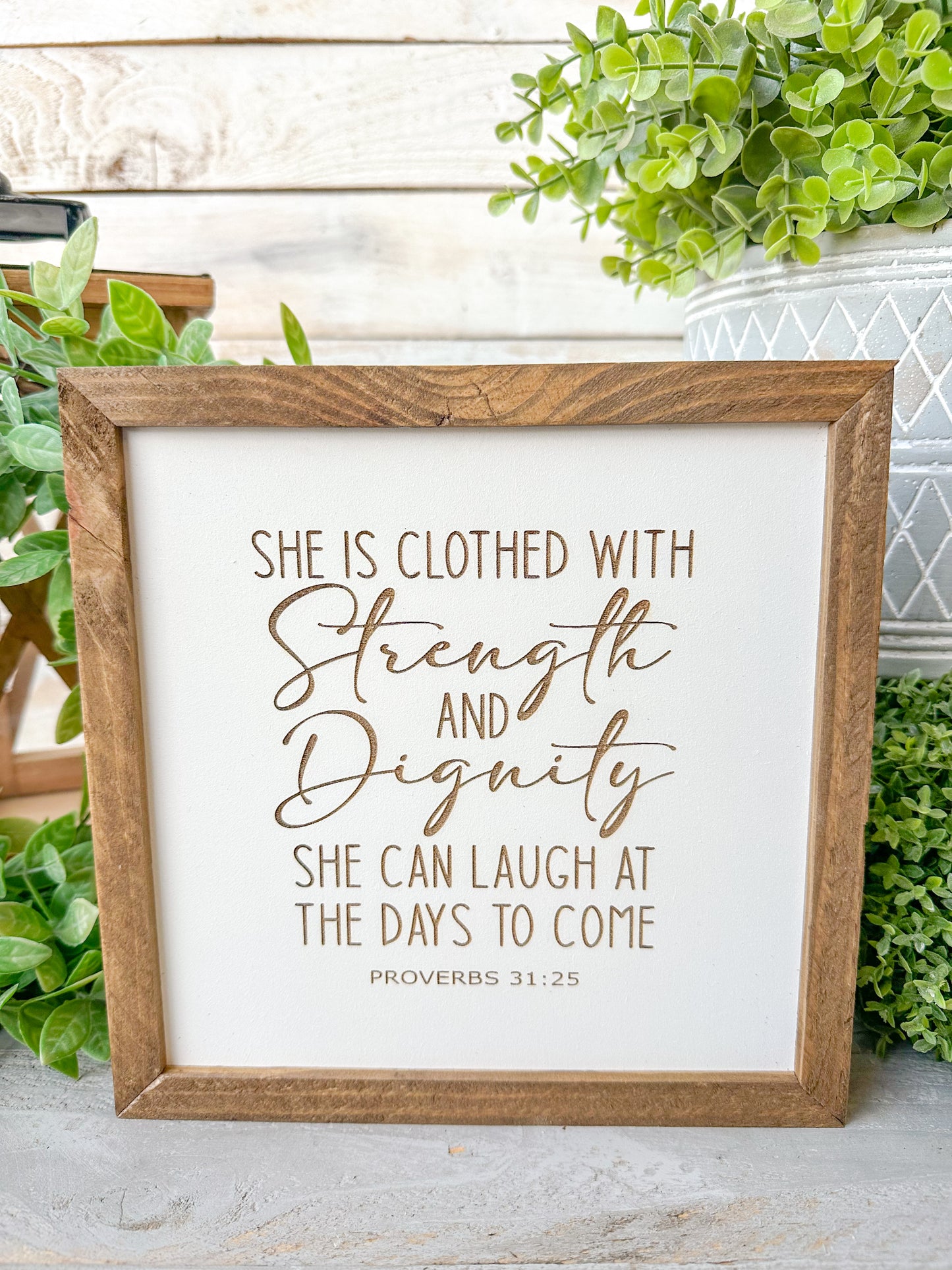She is closed with strength and dignity. She can laugh at the days to come Proverbs 31:25. Laser engraved wood sign.