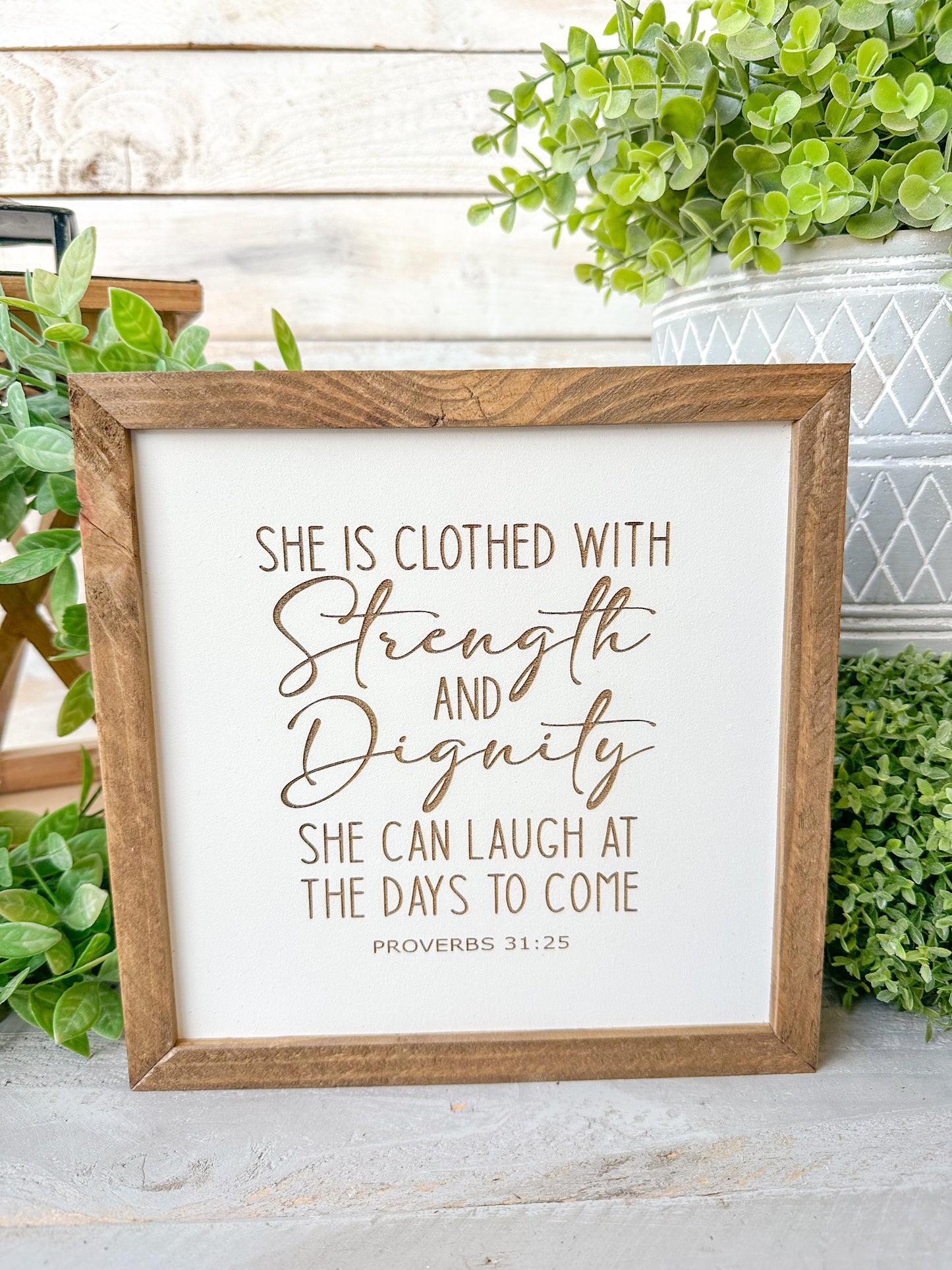 She is closed with strength and dignity. She can laugh at the days to come Proverbs 31:25. Laser engraved wood sign.