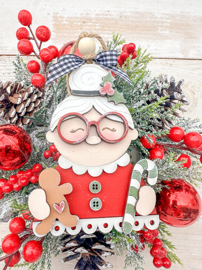 Mrs. Claus with glass, candy canes and ginger