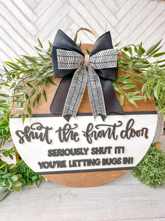 Shut the front door! Seriously shut it! You’re letting the bugs in! Wooden door round.