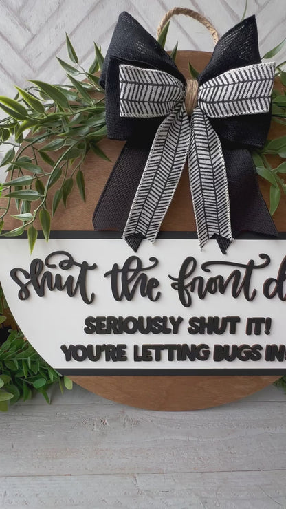 Shut the front door! Seriously shut it! You’re letting the bugs in! Wooden door round.