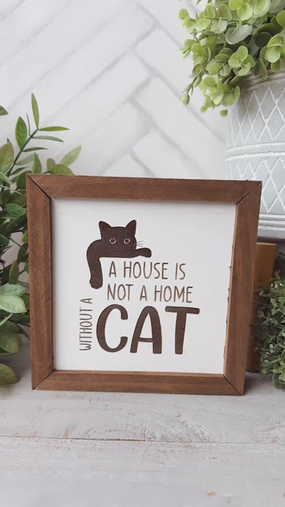 A house is not a home without a cat. Laser engraved wood sign.